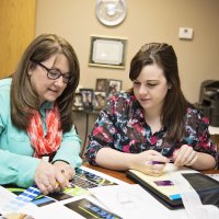 Discussing exhibit details with customer