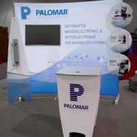 Customized 10x10 HangTen with monitor, stand-off graphics, and bag holder designed by Vision Exhibits
