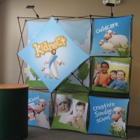 8' XPlus with fabric graphics and case to counter kit designed by Vision Exhibits