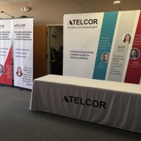 TELCOR accommodates 10x20 and 10x10 spaces with the 10' Envision backwall and bannerstands. From Vision Exhibits.